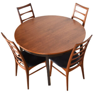 American Modernist Round to Oval Expanding Walnut Table Top + Ebonized Legs